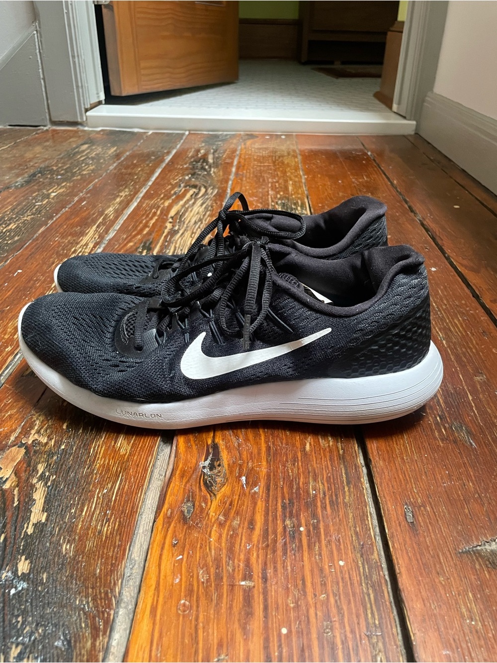 Nike Men’s Black Athletic Running Shoes with White Swoosh